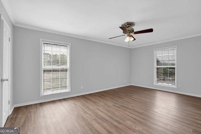 unfurnished room with a ceiling fan, baseboards, ornamental molding, and wood finished floors
