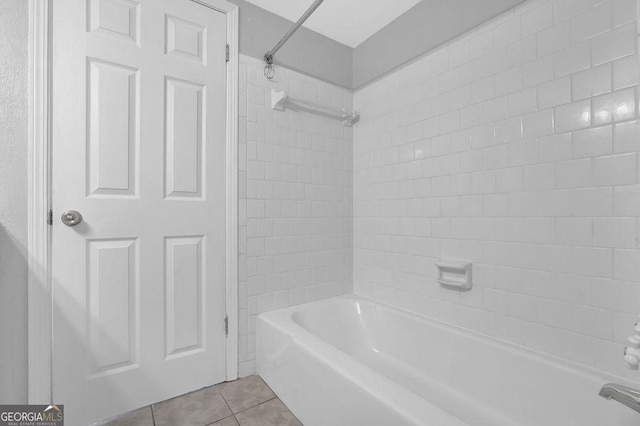 bathroom featuring tile patterned flooring and bathtub / shower combination
