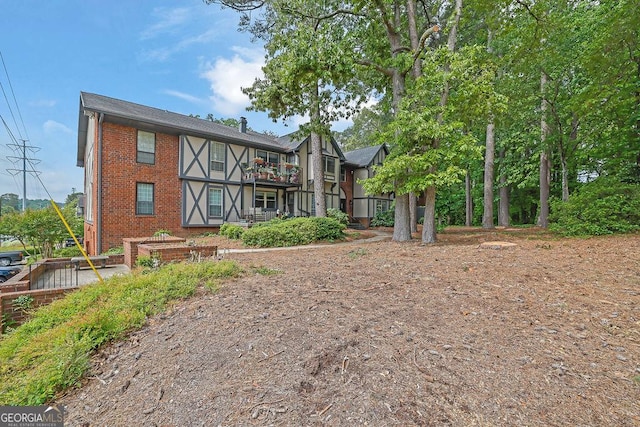rear view of house with brick siding