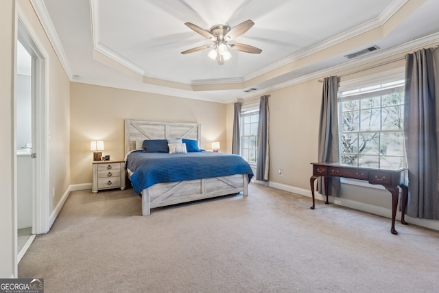 1236 Brickton Dr NW, Atlanta, GA 30318 - carpeted bedroom with a raised ceiling, ornamental molding, multiple windows, and baseboards