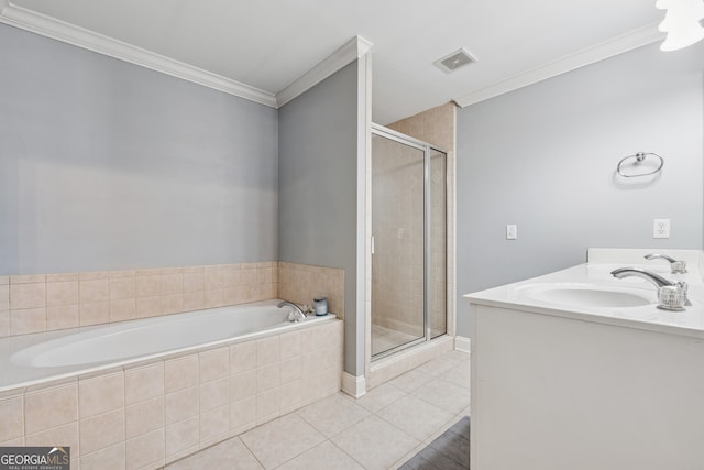 1236 Brickton Dr NW, Atlanta, GA 30318 - bathroom featuring a stall shower, a bath, crown molding, tile patterned flooring, and double vanity