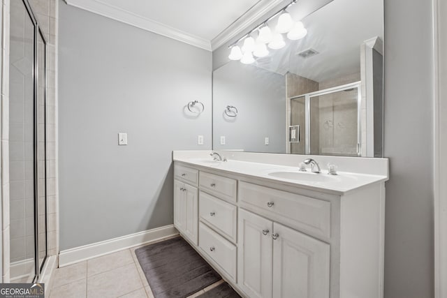 1236 Brickton Dr NW, Atlanta, GA 30318 - bathroom featuring crown molding, a stall shower, double vanity, tile patterned floors, and baseboards