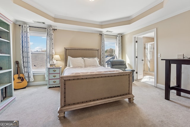 1236 Brickton Dr NW, Atlanta, GA 30318 - carpeted bedroom with ornamental molding, a tray ceiling, baseboards, and ensuite bathroom