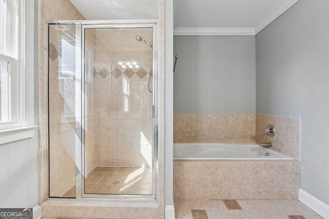 1236 Brickton Dr NW, Atlanta, GA 30318 - bathroom with a shower stall, a garden tub, tile patterned flooring, ornamental molding, and baseboards