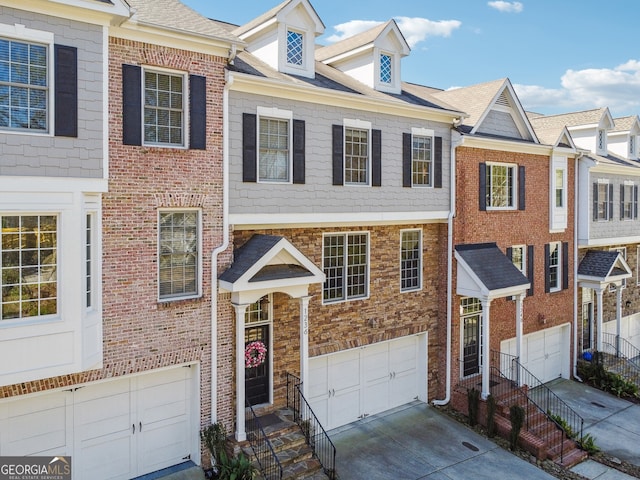 1236 Brickton Dr NW, Atlanta, GA 30318 - view of front of house featuring a garage and driveway
