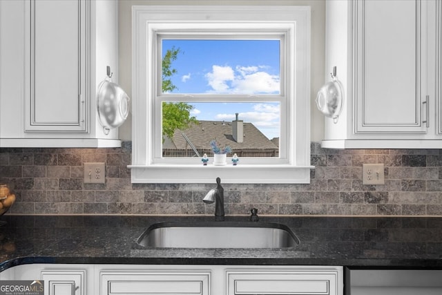 5950 Hidden Ridge Ct, Cumming, GA 30028 - kitchen featuring white cabinets and backsplash