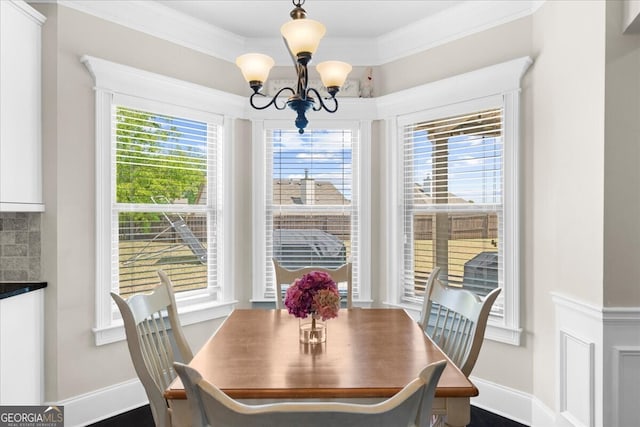 5950 Hidden Ridge Ct, Cumming, GA 30028 - dining space with a chandelier and crown molding