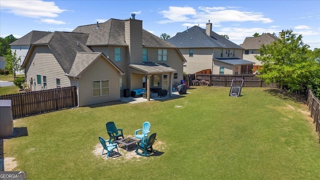 5950 Hidden Ridge Ct, Cumming, GA 30028 - rear view of house featuring a fire pit, a fenced backyard, a patio area, a chimney, and a shingled roof