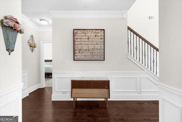 5950 Hidden Ridge Ct, Cumming, GA 30028 - staircase with ornamental molding, wood finished floors, a decorative wall, and a wainscoted wall