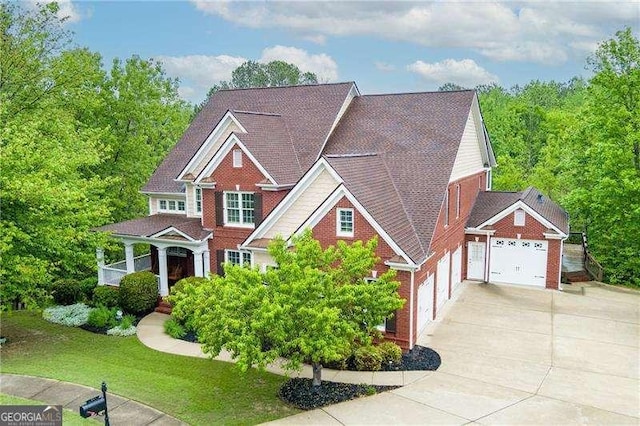 51 Sagemont Ct, Acworth, GA 30101 - craftsman-style home featuring brick siding, an attached garage, a front yard, and concrete driveway
