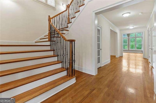 51 Sagemont Ct, Acworth, GA 30101 - stairs with wood finished floors, baseboards, and ornamental molding