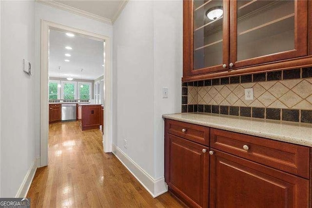 51 Sagemont Ct, Acworth, GA 30101 - bar with crown molding, dishwasher, backsplash, baseboards, and dark wood-style flooring