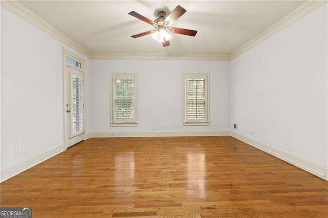 51 Sagemont Ct, Acworth, GA 30101 - empty room featuring wood finished floors, crown molding, and ceiling fan