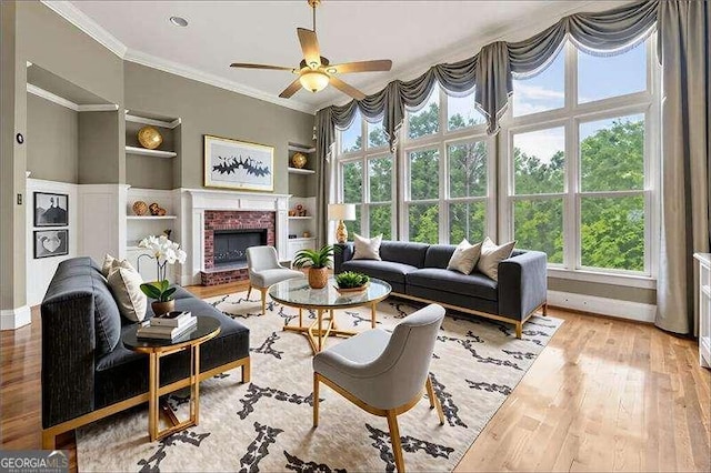51 Sagemont Ct, Acworth, GA 30101 - living room featuring wood finished floors, a wealth of natural light, built in shelves, and ornamental molding