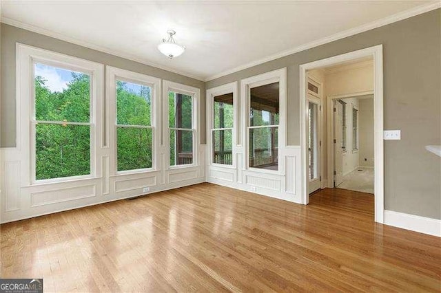 51 Sagemont Ct, Acworth, GA 30101 - interior space featuring wood finished floors, a decorative wall, ornamental molding, and french doors