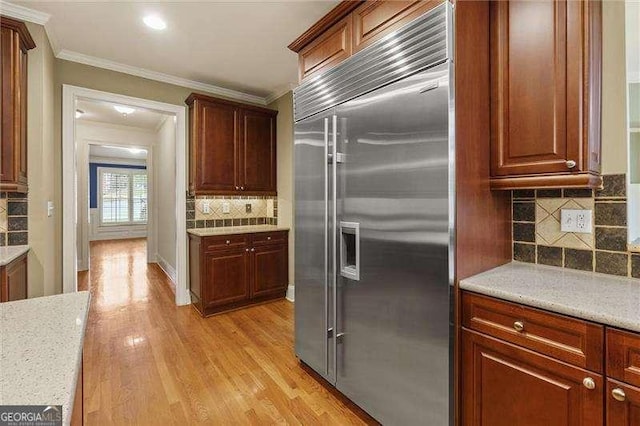 51 Sagemont Ct, Acworth, GA 30101 - kitchen featuring recessed lighting, light wood finished floors, backsplash, crown molding, and built in fridge