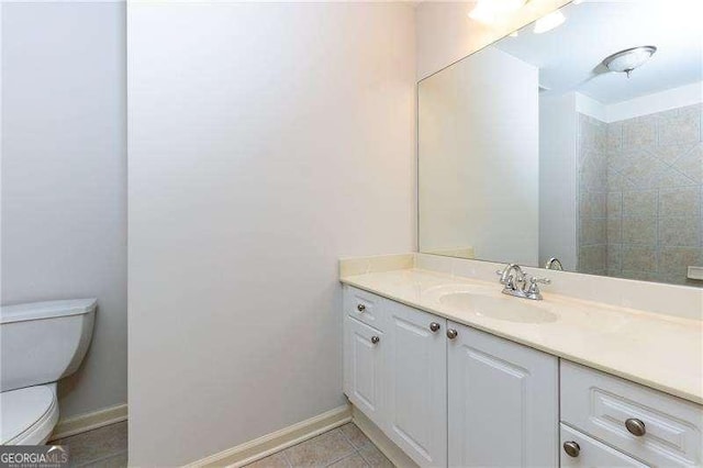 51 Sagemont Ct, Acworth, GA 30101 - bathroom with baseboards, toilet, vanity, and tile patterned floors