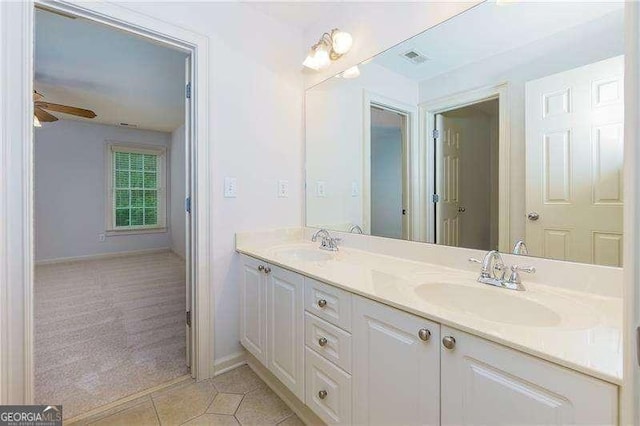 51 Sagemont Ct, Acworth, GA 30101 - bathroom with tile patterned flooring, double vanity, a ceiling fan, and a sink