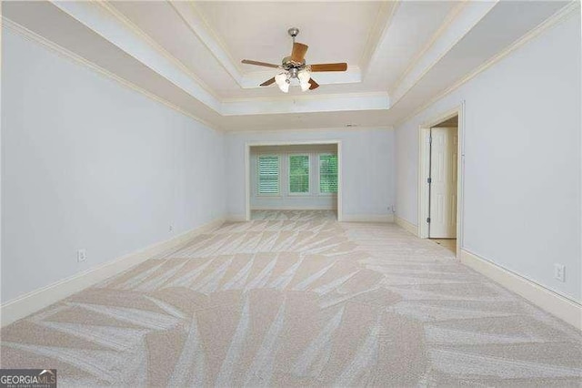 51 Sagemont Ct, Acworth, GA 30101 - carpeted spare room featuring a ceiling fan, baseboards, a raised ceiling, and ornamental molding