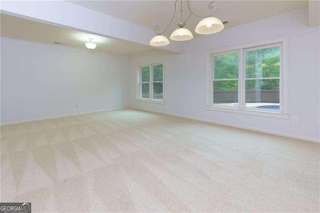 51 Sagemont Ct, Acworth, GA 30101 - empty room featuring baseboards, a notable chandelier, and light colored carpet