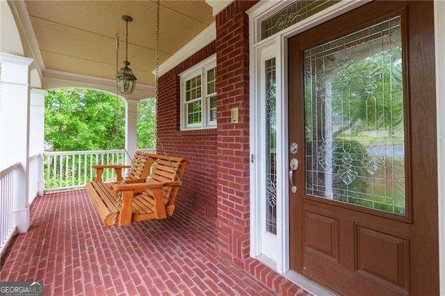 51 Sagemont Ct, Acworth, GA 30101 - view of exterior entry with brick siding and covered porch
