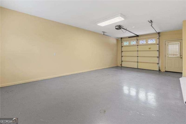 51 Sagemont Ct, Acworth, GA 30101 - garage featuring baseboards and a garage door opener