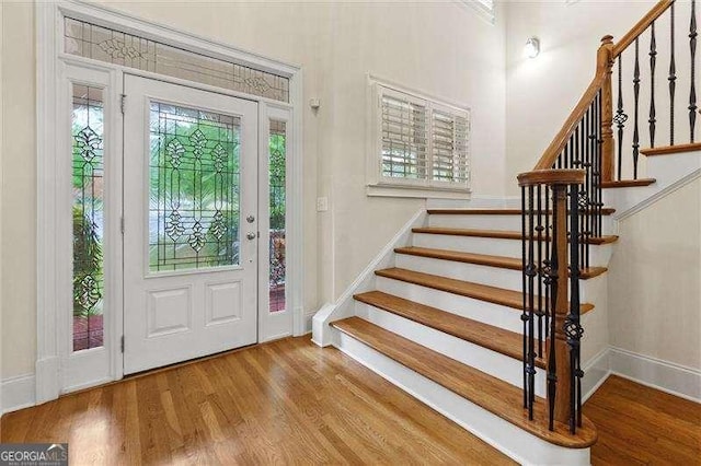 51 Sagemont Ct, Acworth, GA 30101 - entrance foyer with stairway, a wealth of natural light, wood finished floors, and baseboards
