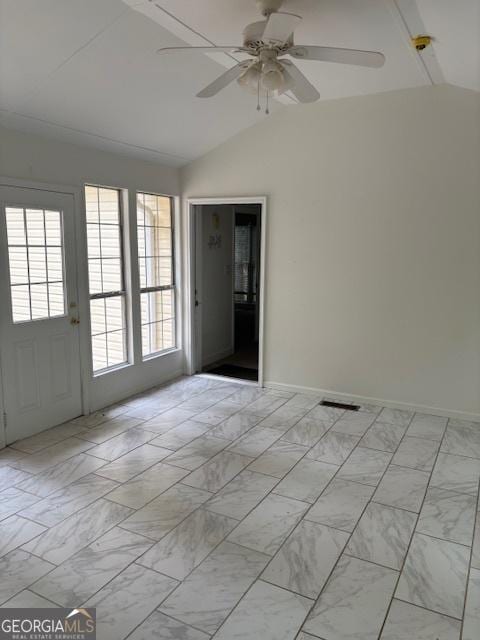 unfurnished living room featuring wood finished floors, brick wall, ceiling fan, baseboards, and ornamental molding