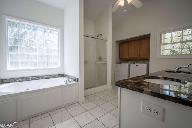 clothes washing area featuring washer and dryer, baseboards, cabinet space, and marble finish floor
