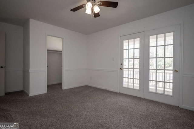 unfurnished bedroom with a ceiling fan, baseboards, carpet floors, and a closet