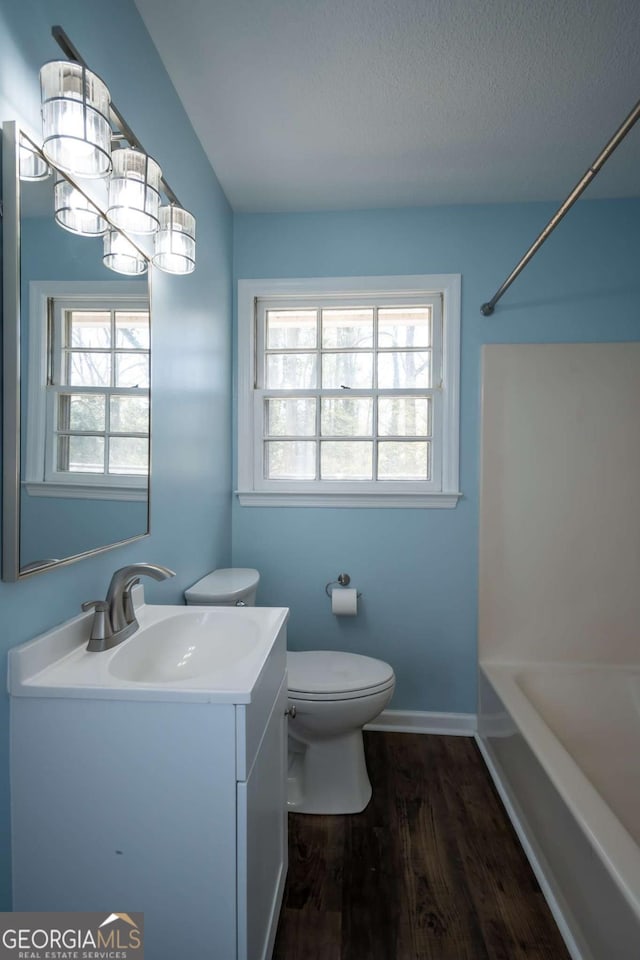 unfurnished bedroom with baseboards, visible vents, carpet floors, and two closets
