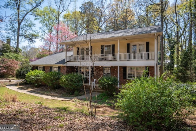 back of house featuring french doors and covered porch