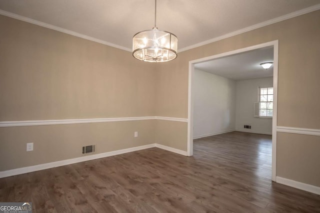 unfurnished dining area featuring dark wood finished floors, baseboards, visible vents, a chandelier, and ornamental molding