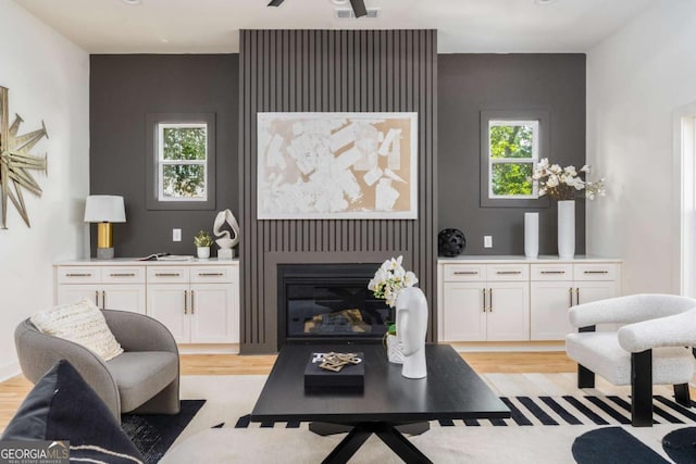 156 Martha Ave NE, Atlanta, GA 30317 - living room with light wood-type flooring and a glass covered fireplace