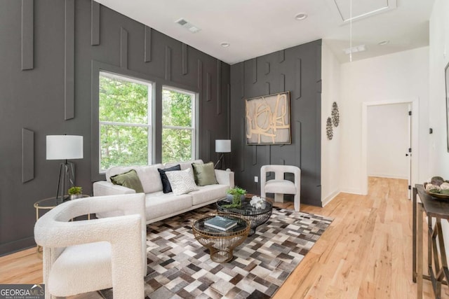 156 Martha Ave NE, Atlanta, GA 30317 - living room with attic access, light wood-style floors, and baseboards