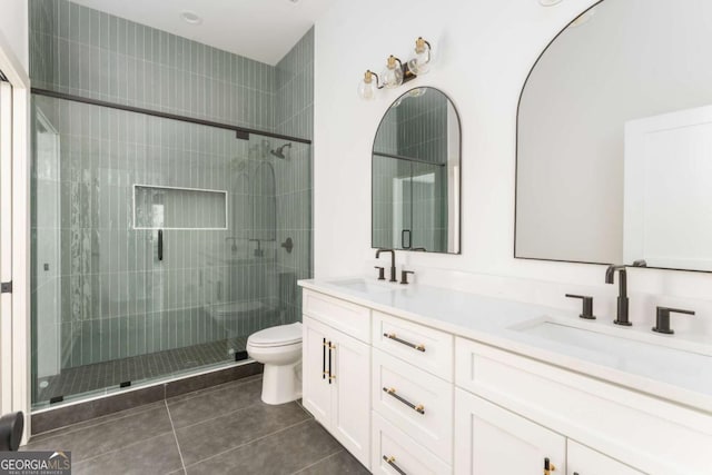 156 Martha Ave NE, Atlanta, GA 30317 - full bath featuring tile patterned floors, toilet, a stall shower, and double vanity