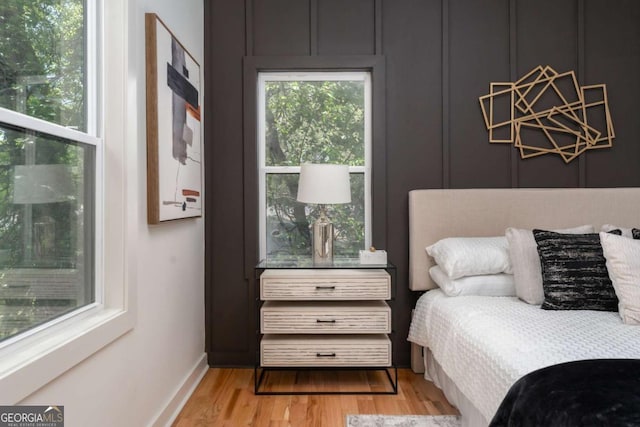 156 Martha Ave NE, Atlanta, GA 30317 - bedroom with wood finished floors, a chandelier, and baseboards