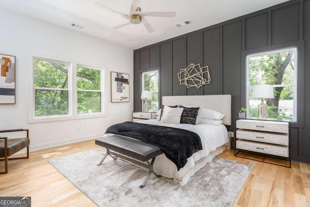 156 Martha Ave NE, Atlanta, GA 30317 - bedroom with multiple windows, light wood finished floors, baseboards, and a ceiling fan
