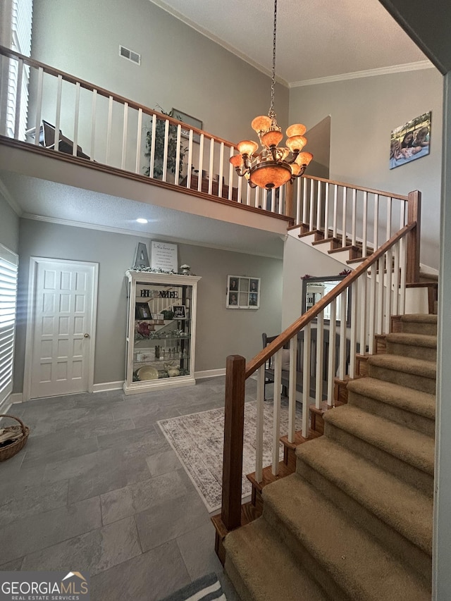 1323 Fairway Dr, Elberton, GA 30635 - staircase with a textured ceiling, visible vents, crown molding, and a notable chandelier