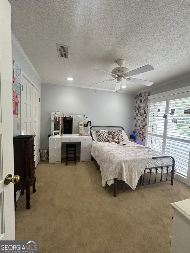 1323 Fairway Dr, Elberton, GA 30635 - bedroom with light carpet, visible vents, a ceiling fan, a textured ceiling, and crown molding