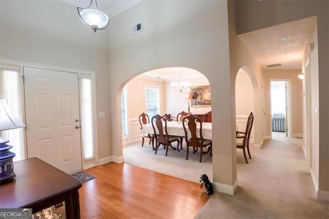 152 Cooper Creek Dr, Dallas, GA 30157 - entrance foyer with a high ceiling, arched walkways, visible vents, and baseboards