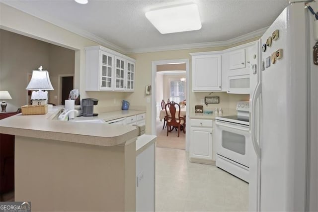 152 Cooper Creek Dr, Dallas, GA 30157 - kitchen with a peninsula, a sink, glass insert cabinets, white appliances, and light countertops