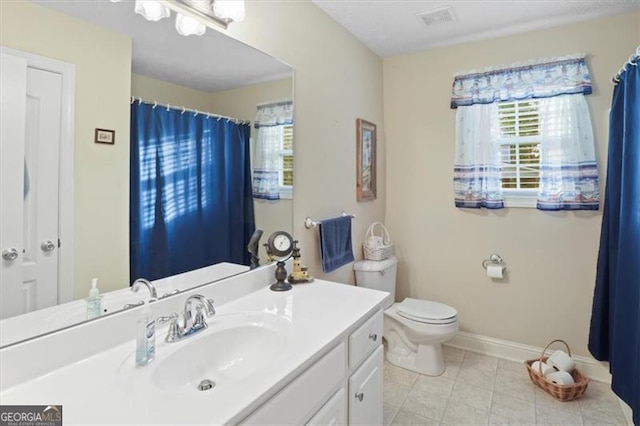 152 Cooper Creek Dr, Dallas, GA 30157 - bathroom with toilet, vanity, baseboards, tile patterned flooring, and visible vents