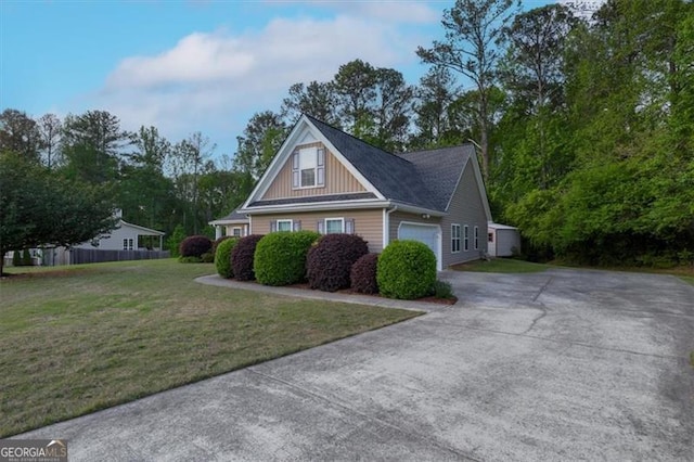 152 Cooper Creek Dr, Dallas, GA 30157 - view of front of home with concrete driveway, a front lawn, board and batten siding, an attached garage, and fence