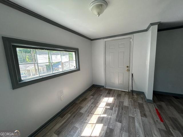 2016 Conrad Ave SE, Atlanta, GA 30315 - empty room with baseboards, wood finished floors, and ornamental molding