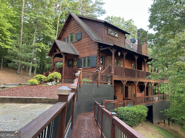 rear view of property with a chimney