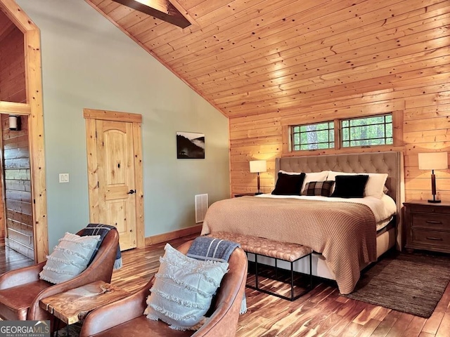 bedroom with wood walls, wood finished floors, high vaulted ceiling, wood ceiling, and baseboards