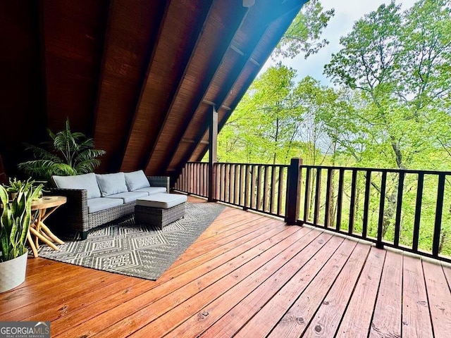 wooden deck featuring outdoor lounge area