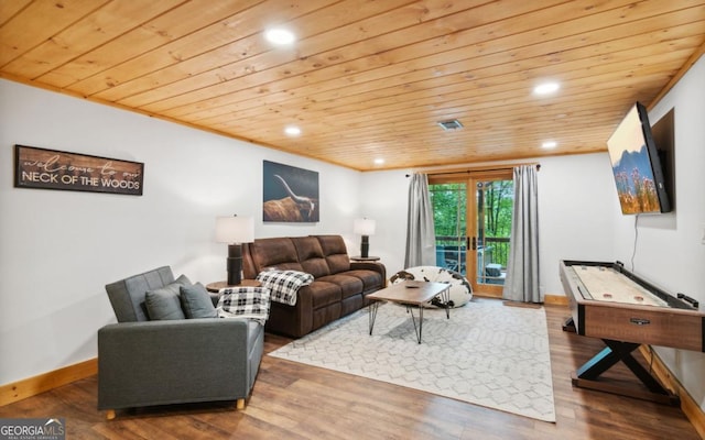 living area featuring wood ceiling, recessed lighting, wood finished floors, and baseboards