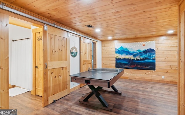game room with wood ceiling, wood finished floors, wood walls, and recessed lighting